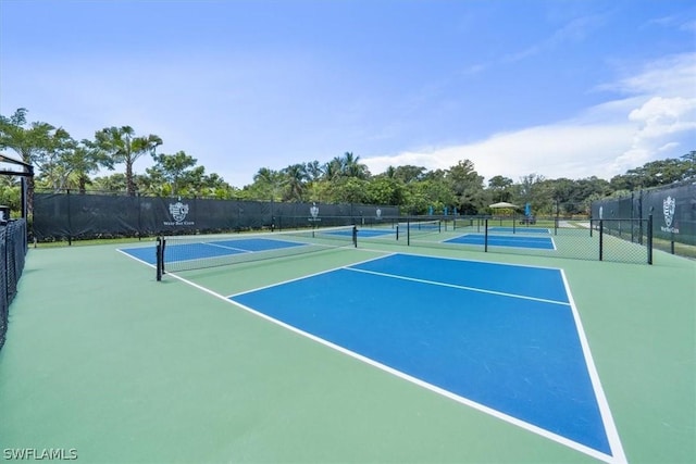 view of tennis court featuring basketball court