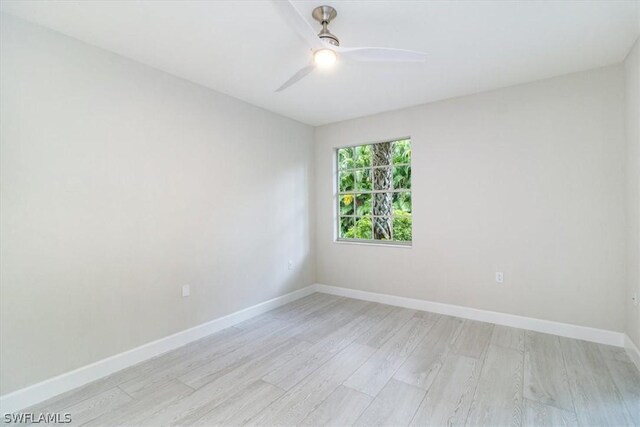 spare room featuring ceiling fan and light hardwood / wood-style flooring