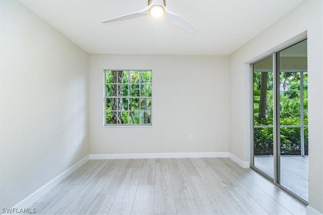 unfurnished room featuring light wood-type flooring, ceiling fan, and plenty of natural light