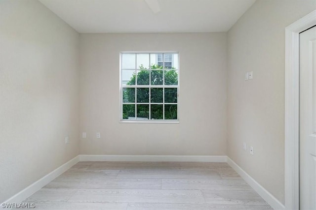 unfurnished room with light hardwood / wood-style floors