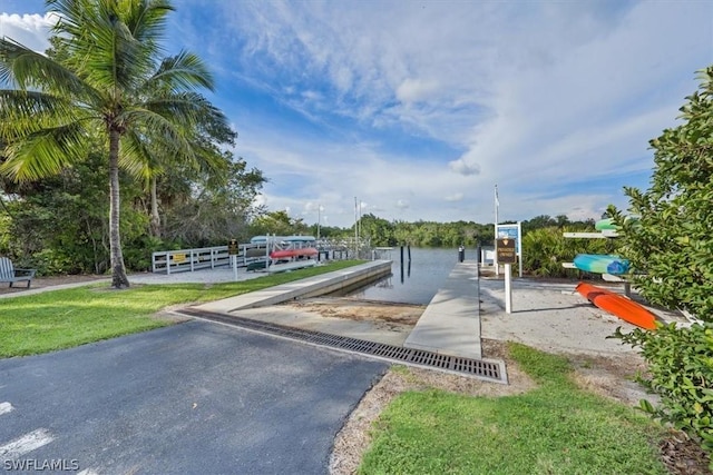 exterior space with a boat dock and a water view