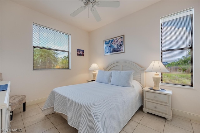 bedroom featuring ceiling fan and light tile floors