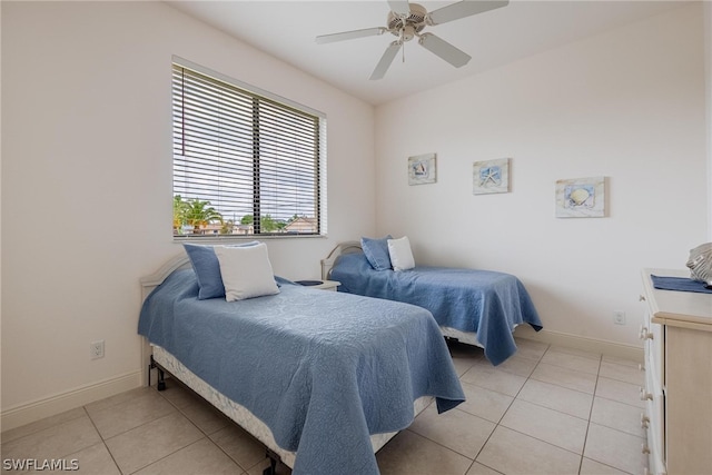 tiled bedroom with ceiling fan