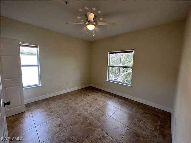 unfurnished room featuring ceiling fan