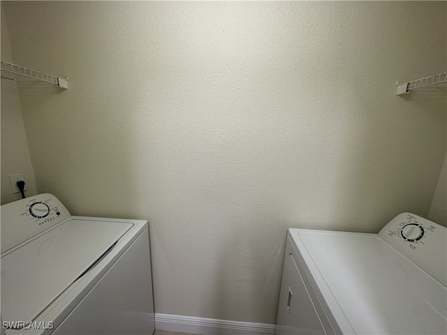 washroom with separate washer and dryer