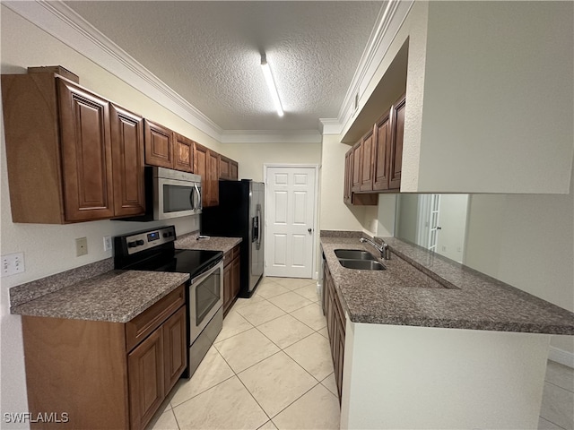 kitchen featuring stainless steel appliances, a textured ceiling, sink, light tile patterned floors, and ornamental molding