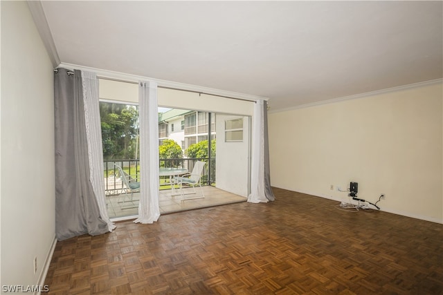 empty room with dark parquet flooring and crown molding