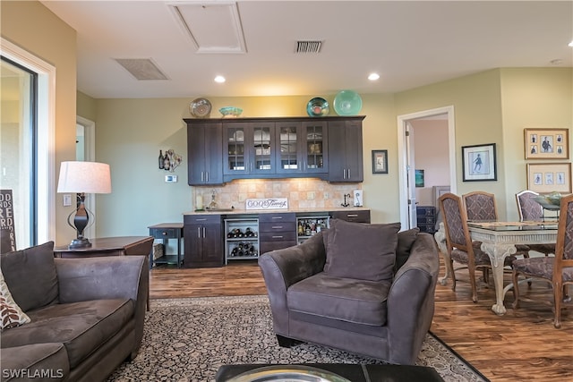 living room featuring dark wood-type flooring and beverage cooler