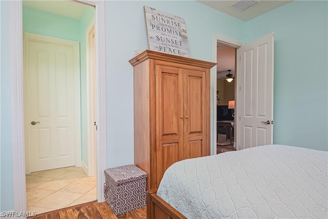 bedroom featuring visible vents