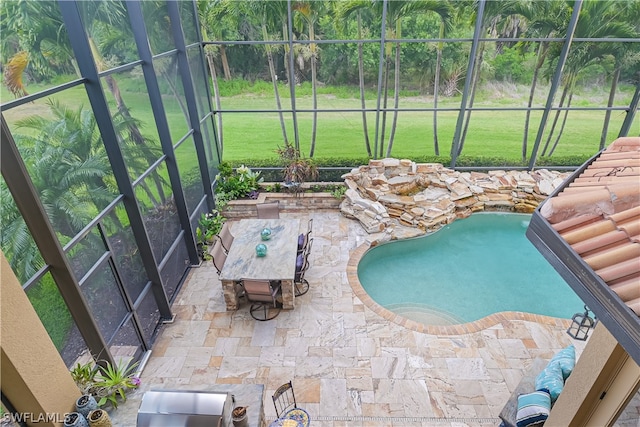 view of pool with a patio, a lanai, and a yard