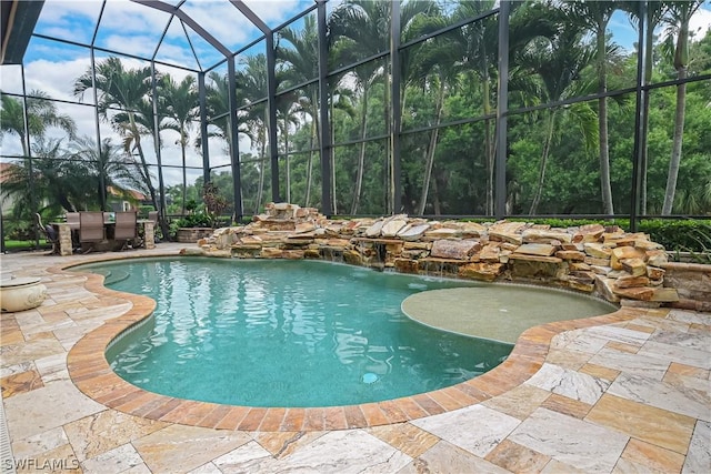 pool with glass enclosure and a patio