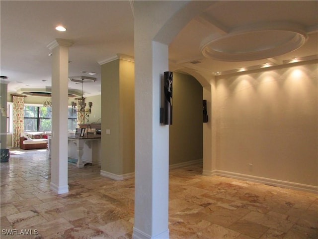hallway with baseboards, arched walkways, and recessed lighting