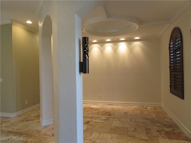 hallway with crown molding, baseboards, stone finish floor, and recessed lighting