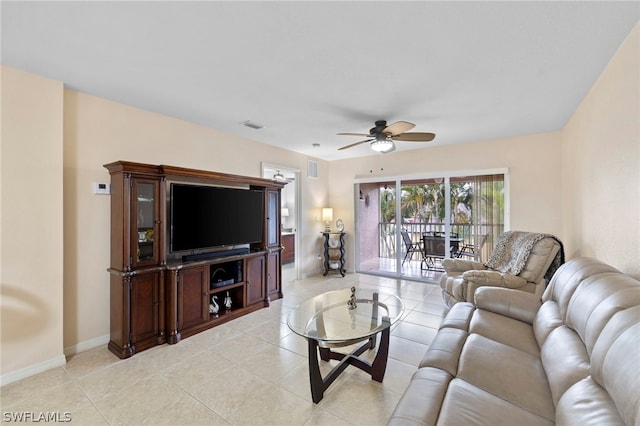 living room with ceiling fan and light tile flooring