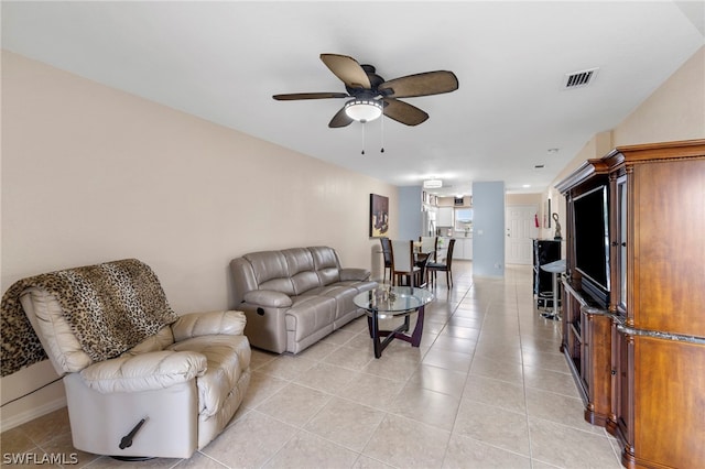 living room with ceiling fan and light tile floors