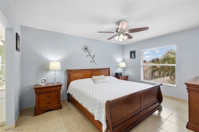 bedroom with ceiling fan and light tile floors