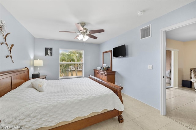 tiled bedroom with ceiling fan