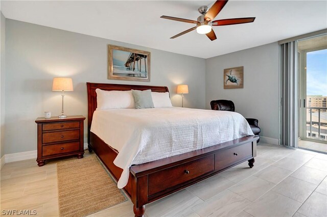 bedroom with baseboards, a wall of windows, a ceiling fan, and access to exterior