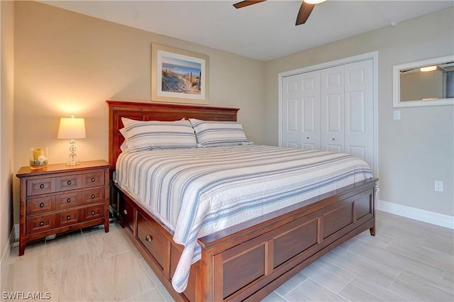 bedroom with a closet, ceiling fan, and baseboards
