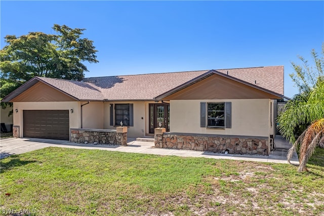 single story home with a front lawn and a garage