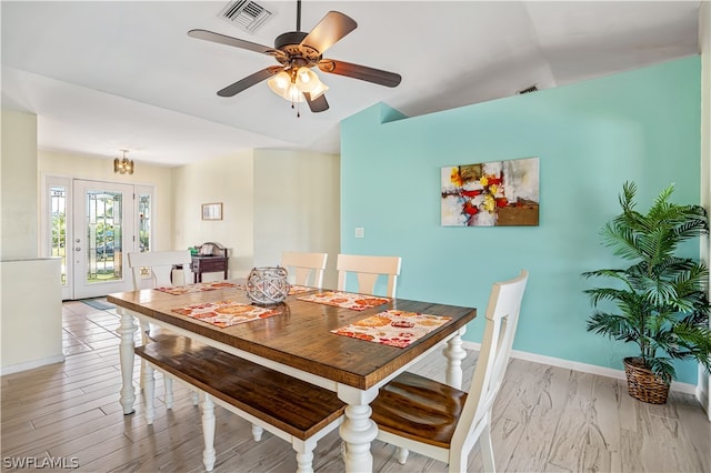 dining area featuring hardwood / wood-style floors, ceiling fan, and lofted ceiling