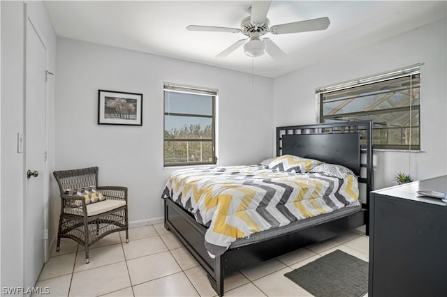 tiled bedroom with ceiling fan