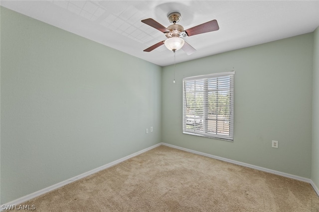 empty room with ceiling fan and light colored carpet