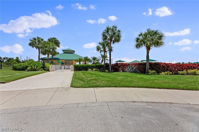 view of front facade featuring a gazebo and a front yard