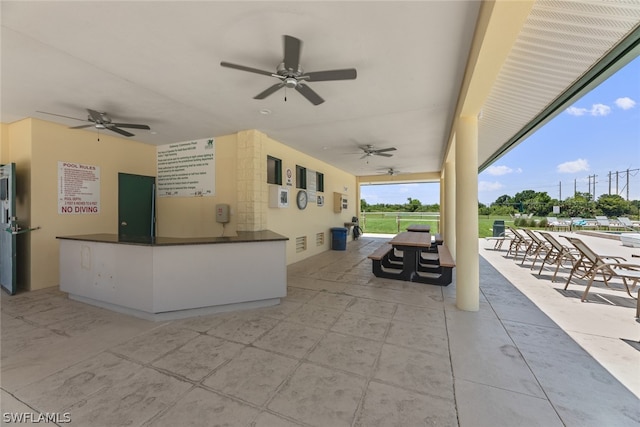 view of patio featuring ceiling fan