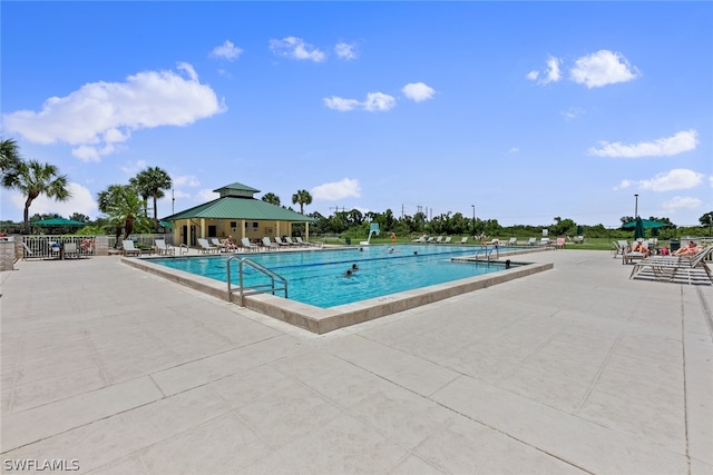 view of swimming pool with a patio area