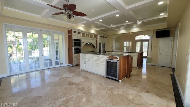 kitchen with ceiling fan, coffered ceiling, a wealth of natural light, and wine cooler