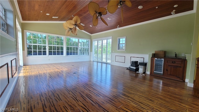 unfurnished living room featuring ceiling fan, dark hardwood / wood-style flooring, wooden ceiling, ornamental molding, and wine cooler