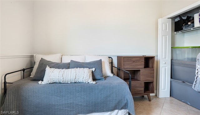 bedroom with tile patterned floors