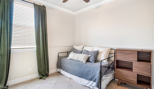 bedroom with crown molding, ceiling fan, and tile patterned floors