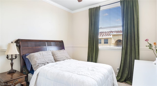 bedroom with crown molding and ceiling fan