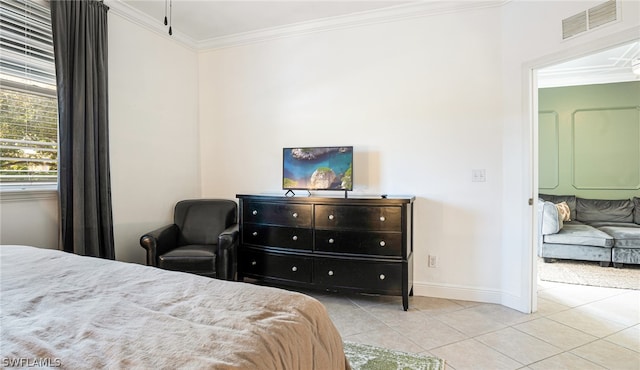 bedroom featuring light tile patterned flooring and ornamental molding