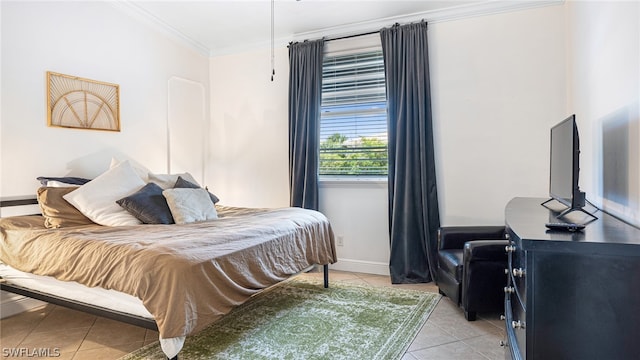 bedroom with crown molding and tile patterned flooring