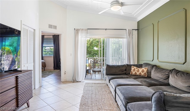 tiled living room with lofted ceiling, a healthy amount of sunlight, and ceiling fan