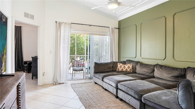 tiled living room with ceiling fan and vaulted ceiling