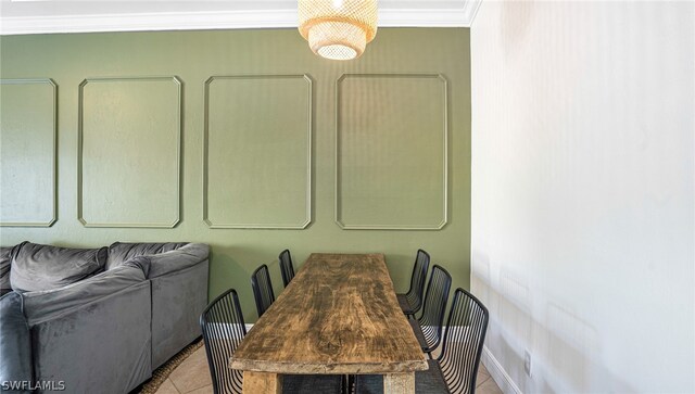 tiled dining room with crown molding