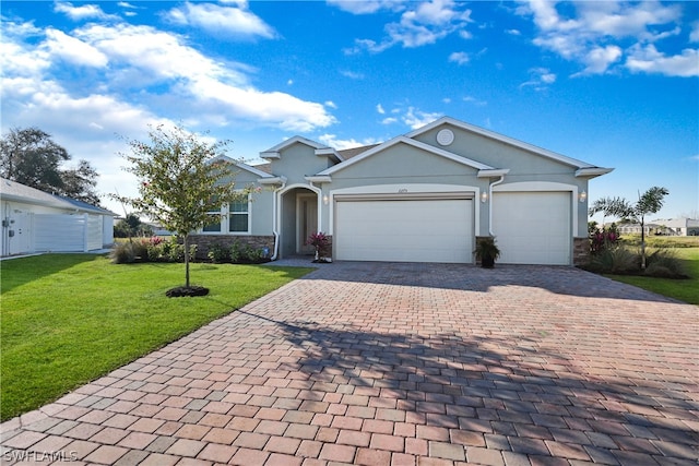 ranch-style home featuring a garage and a front yard