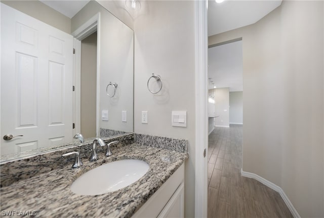 bathroom with wood-type flooring and vanity