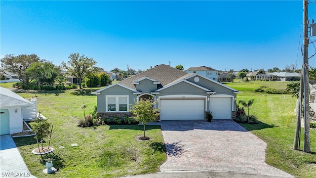 ranch-style home with a front lawn and a garage