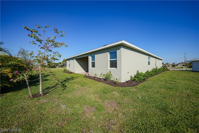 view of home's exterior with a yard