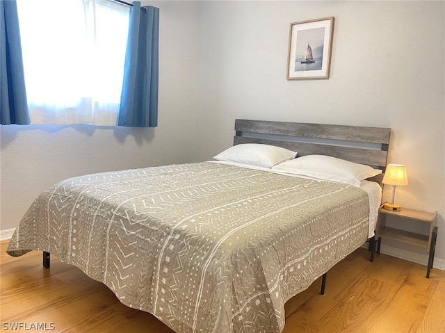 bedroom featuring hardwood / wood-style flooring