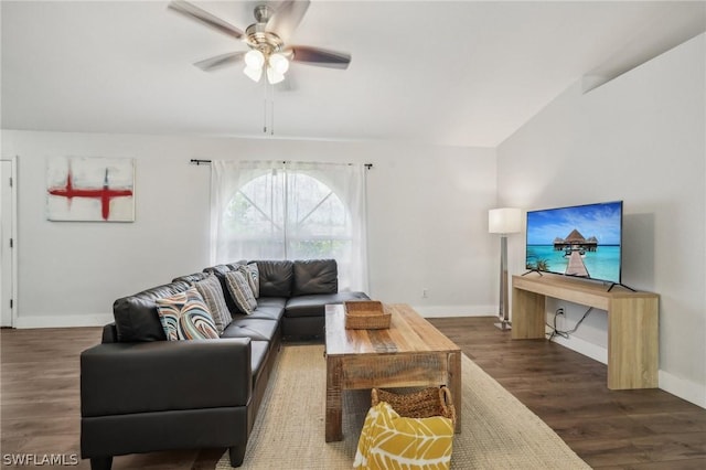 living room with ceiling fan and dark hardwood / wood-style flooring