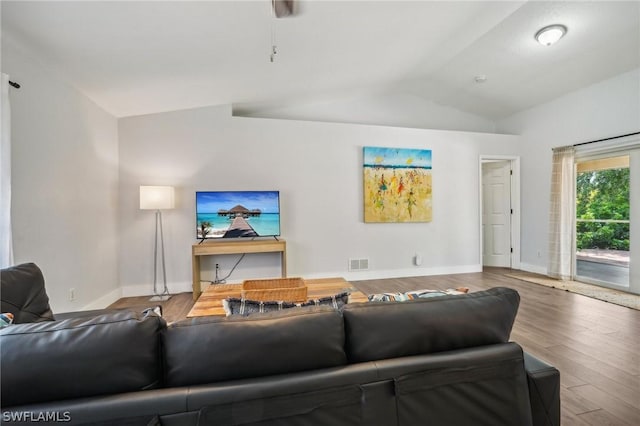 living room with lofted ceiling and hardwood / wood-style floors