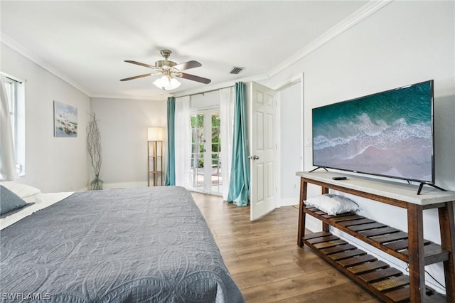 bedroom with ceiling fan, access to exterior, hardwood / wood-style flooring, and ornamental molding