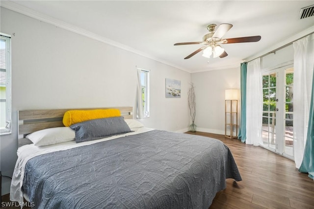 bedroom featuring ceiling fan, access to exterior, dark hardwood / wood-style flooring, and crown molding