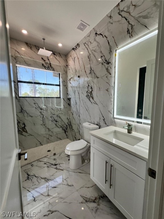 bathroom featuring vanity, toilet, an enclosed shower, and tile walls